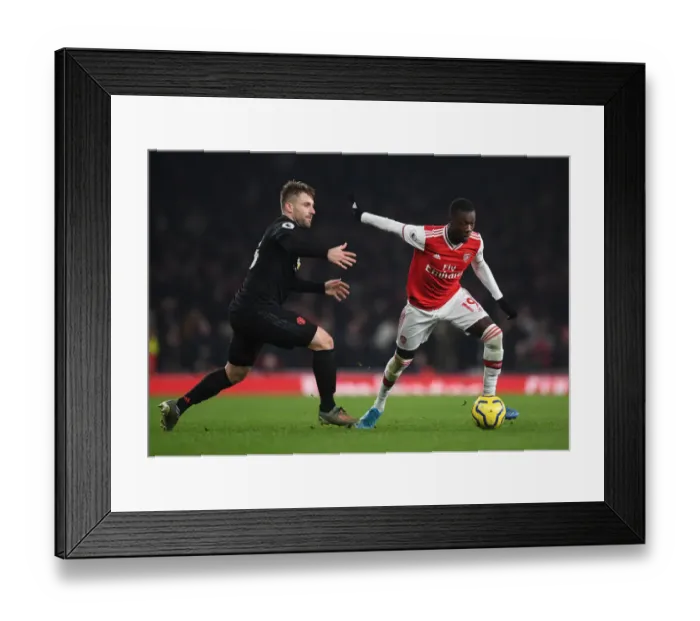 Framed Print : Pepe vs Shaw: A Premier League Battle at Emirates Stadium