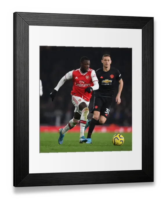 Framed Print : Pepe vs Manchester United: Clash of the Titans at the Emirates