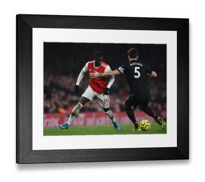 Framed Print : Arsenal vs Manchester United: Pepe Fouls by Maguire - Premier League Clash (2019-20)