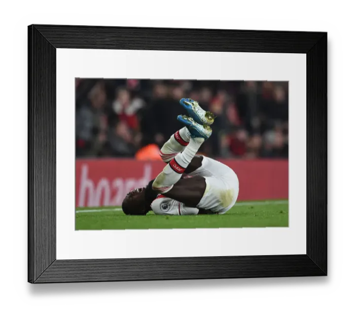 Framed Print : Pepe vs Manchester United: Arsenal Star's Premier League Showdown