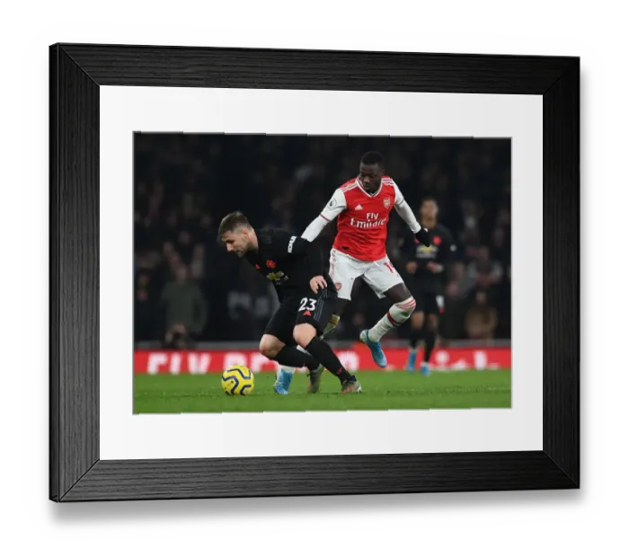 Framed Print : Pepe vs Shaw: A Premier League Showdown - Arsenal vs Manchester United