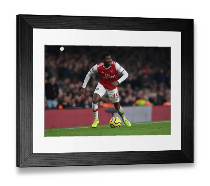 Framed Print : Arsenal's Ainsley Maitland-Niles Goes Head-to-Head with Manchester United in Premier League Showdown (2019-20)