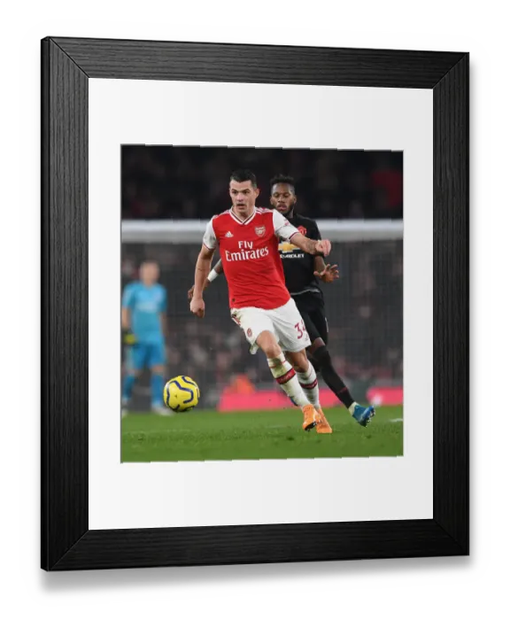 Framed Print : Arsenal vs Manchester United: Xhaka vs Fred Clash in Premier League Showdown