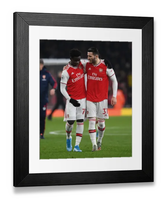 Framed Print : Arsenal's Saka and Kolasinac Celebrate Victory Over Manchester United in Premier League Clash Framed Print : Arsenal's Saka and Kolasinac Celebrate Victory Over Manchester United in Premier League Clash