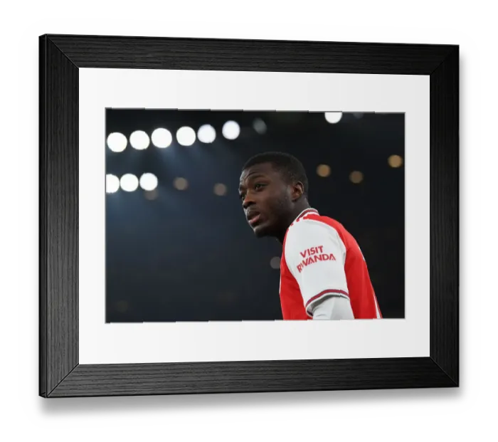Framed Print : Nicolas Pepe's Determination: Arsenal vs Manchester United (2019-20)