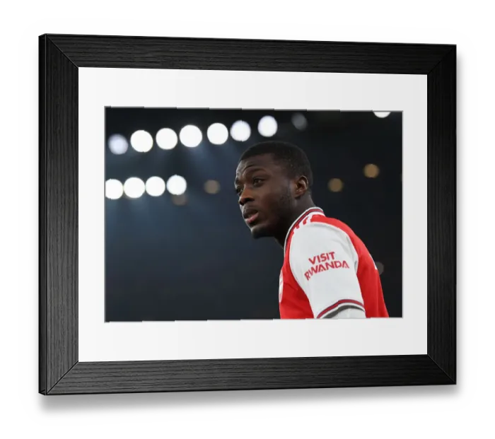 Framed Print : Arsenal's Nicolas Pepe Gears Up for Arsenal v Manchester United Clash (2019-2020)