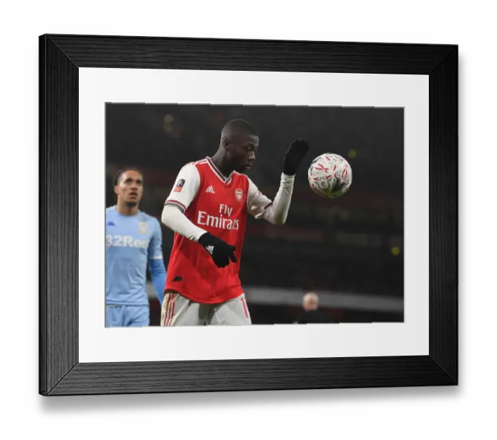 Framed Print : Arsenal's Nicolas Pepe Faces Off Against Leeds United in FA Cup Third Round Framed Print : Arsenal's Nicolas Pepe Faces Off Against Leeds United in FA Cup Third Round