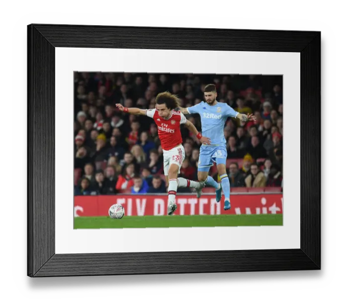 Framed Print : David Luiz: Unwavering Concentration in Arsenal's FA Cup Battle against Leeds United Framed Print : David Luiz: Unwavering Concentration in Arsenal's FA Cup Battle against Leeds United