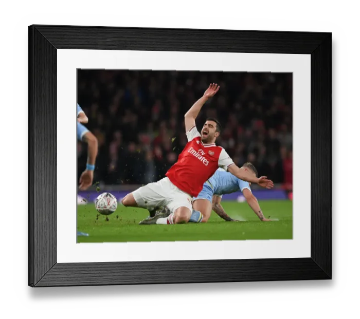 Framed Print : Sokratis vs Phillips: FA Cup Battle at Emirates Stadium Framed Print : Sokratis vs Phillips: FA Cup Battle at Emirates Stadium