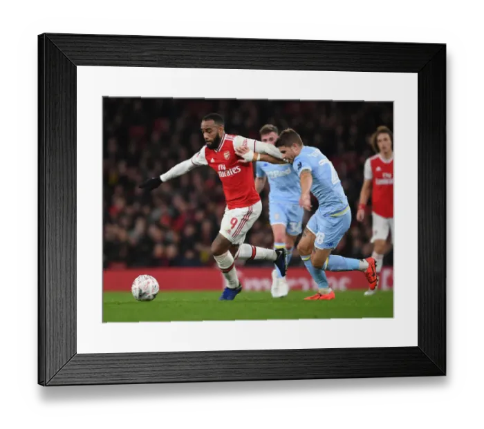 Framed Print : Arsenal's Alex Lacazette Fends Off Leeds Gaetano Berardi in FA Cup Clash Framed Print : Arsenal's Alex Lacazette Fends Off Leeds Gaetano Berardi in FA Cup Clash