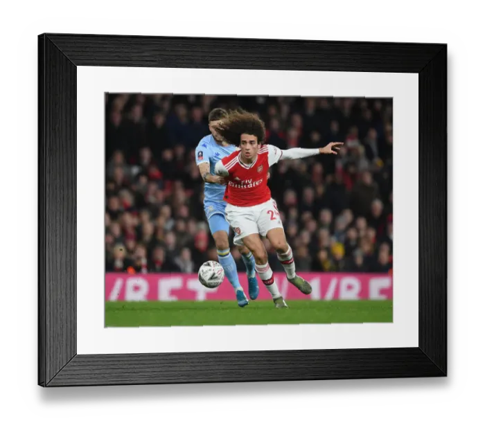 Framed Print : Arsenal's Guendouzi Outmaneuvers Leeds Klich in FA Cup Clash Framed Print : Arsenal's Guendouzi Outmaneuvers Leeds Klich in FA Cup Clash