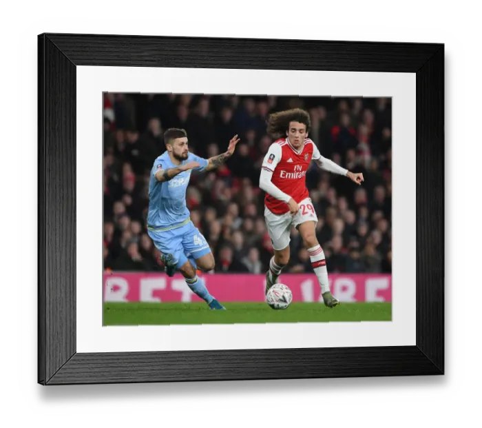 Framed Print : Arsenal's Guendouzi Overpowers Leeds Klich in FA Cup Clash Framed Print : Arsenal's Guendouzi Overpowers Leeds Klich in FA Cup Clash