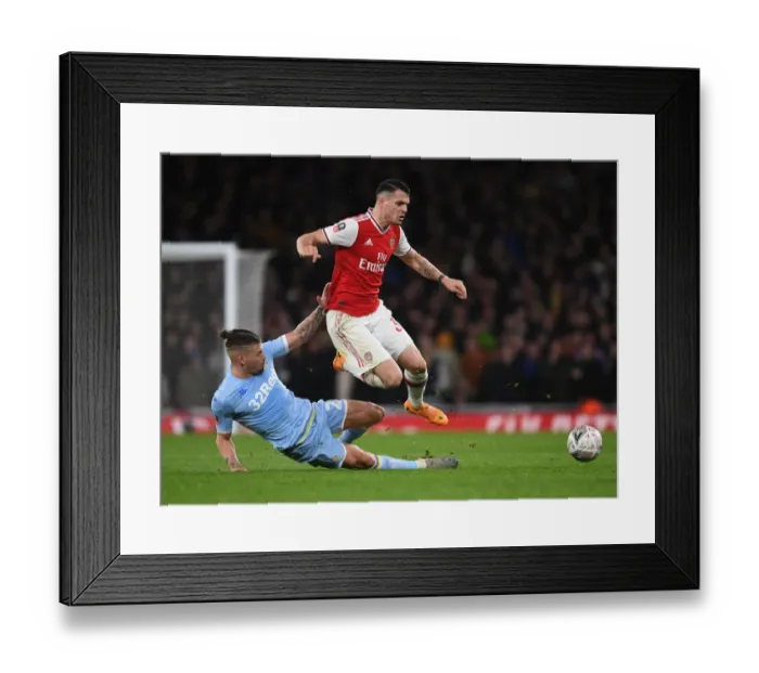 Framed Print : Arsenal's Granit Xhaka Battles Past Leeds Kalvin Phillips in FA Cup Clash
