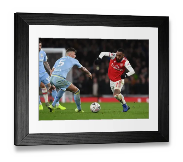 Framed Print : Alexis Lacazette's Sneaky Move: Outsmarting Ben White in Arsenal's FA Cup Triumph over Leeds