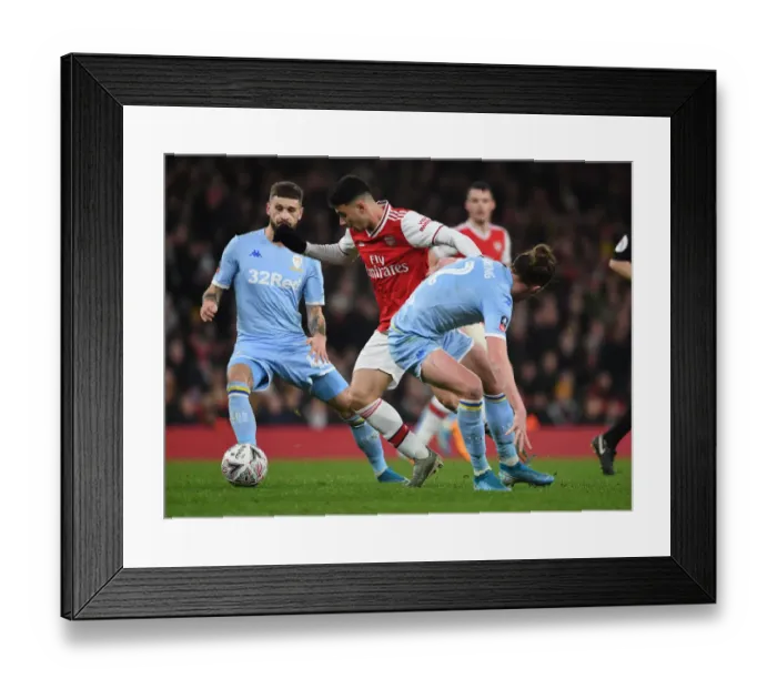 Framed Print : Martinelli vs Ayling: A Fiery FA Cup Showdown between Arsenal and Leeds Framed Print : Martinelli vs Ayling: A Fiery FA Cup Showdown between Arsenal and Leeds