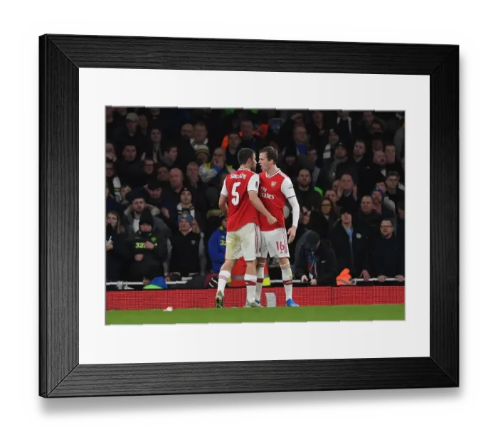 Framed Print : Arsenal's Sokratis and Rob Holding in Action against Leeds United in FA Cup Third Round Framed Print : Arsenal's Sokratis and Rob Holding in Action against Leeds United in FA Cup Third Round