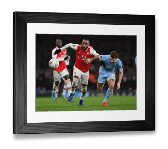 Framed Print : Arsenal's Lacazette Faces Off Against Leeds Berardi in FA Cup Clash