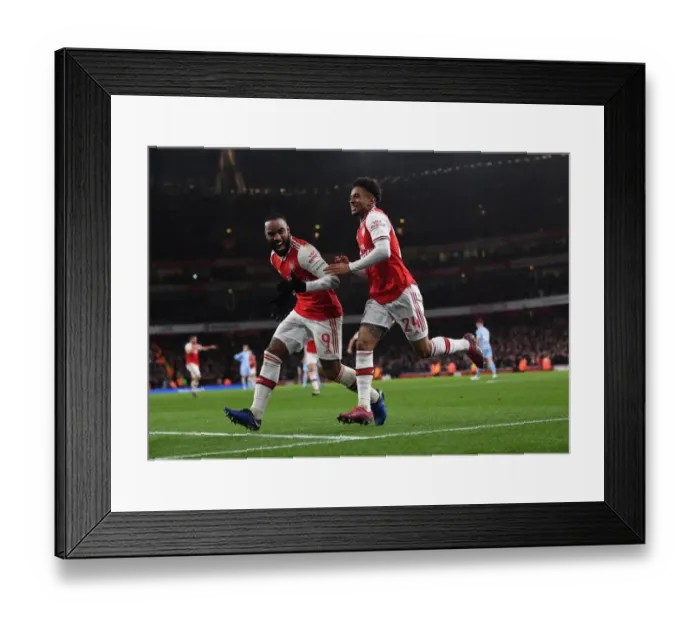 Framed Print : Arsenal's Reiss Nelson and Alexandre Lacazette Celebrate Goal Against Leeds United in FA Cup Third Round