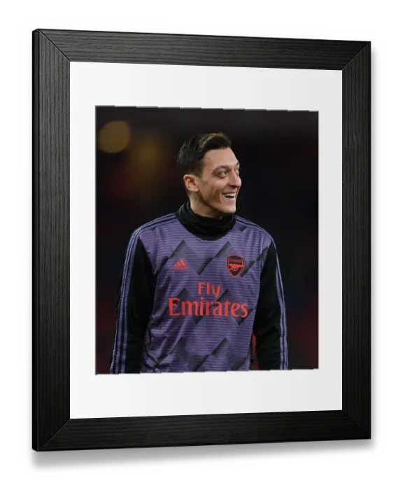 Framed Print : Arsenal's Mesut Ozil Warming Up Ahead of FA Cup Clash Against Leeds United