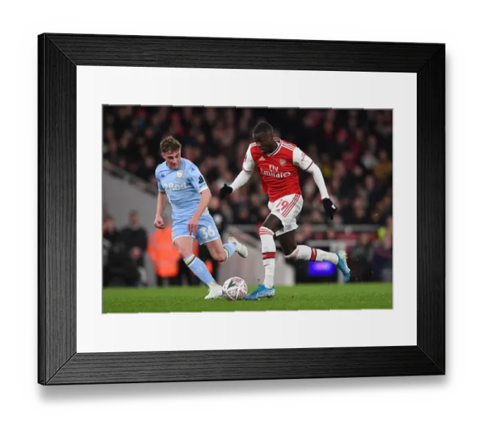 Framed Print : Pepe vs. Gotts: Clash of the FA Cup Third Round at Arsenal's Emirates Stadium
