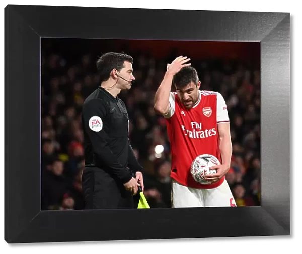 Arsenal vs Leeds United: Sokratis Discusses with the Linesman during FA Cup Clash at Emirates Stadium