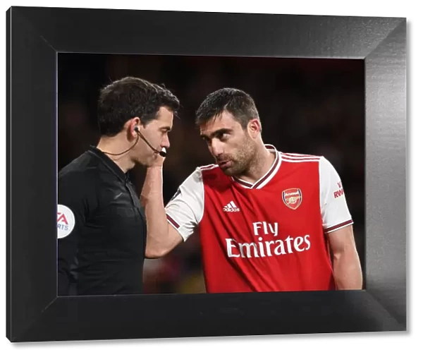 Arsenal's Sokratis in Deep Discussion with FA Cup Linesman: A Pivotal Moment during Arsenal vs Leeds United