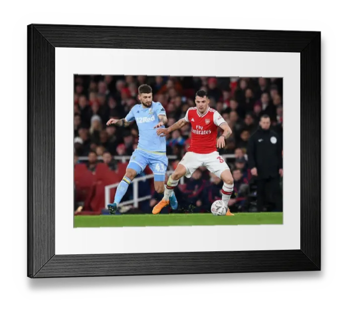Framed Print : Xhaka vs Klich: A Midfield Battle in Arsenal's FA Cup Clash against Leeds United