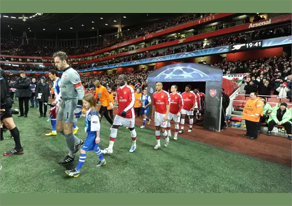 Arsenal captain Manuel Almunia followed by Bacary Sagna and Gael Clichy leads out the team before the match. Arsenal 5: 0 FC Porto, UEFA Champions League First Knockout Round, Second Leg, Emirates Stadium, Arsenal Football Club, London, 9  /  3  /  2010. Credit: Stuart MacFarlane  /  Arsenal