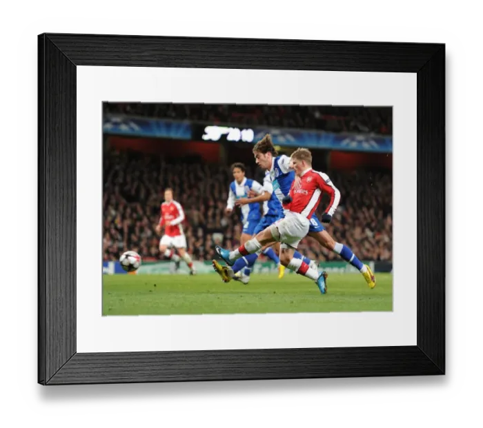 Framed Print : Andrey Arshavin (Arsenal) Nuno Coelho (Porto). Arsenal 5: 0 FC Porto, UEFA Champions League First Knockout Round, Second Leg, Emirates Stadium, Arsenal Football Club, London, 9  /  3  /  2010. Credit : Stuart MacFarlane  / 