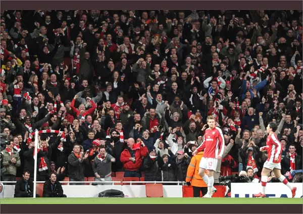 Arsenla fans celebrate the 1st Arsenal goal, scored by Nicklas Bendtner