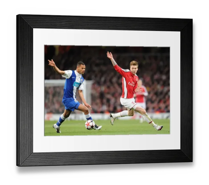 Framed Print : Nicklas Bendtner (Arsenal) Rolando (Porto). Arsenal 5: 0 FC Porto, UEFA Champions League First Knockout Round, Second Leg, Emirates Stadium, Arsenal Football Club, London, 9  /  3  /  2010. Credit : Stuart MacFarlane  / 