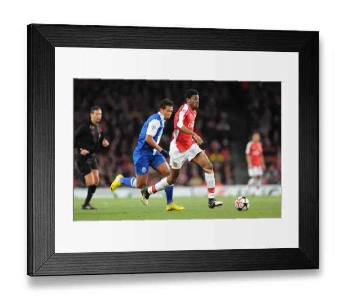 Framed Print : Abou Diaby (Arsenal) Falcao (Porto). Arsenal 5: 0 FC Porto, UEFA Champions League First Knockout Round, Second Leg, Emirates Stadium, Arsenal Football Club, London, 9  /  3  /  2010. Credit : Stuart MacFarlane  / 