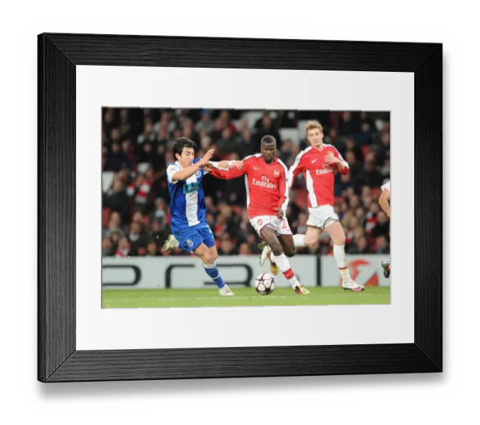 Framed Print : Emmanuel Eboue (Arsenal) Fucile (Porto). Arsenal 5: 0 FC Porto, UEFA Champions League First Knockout Round, Second Leg, Emirates Stadium, Arsenal Football Club, London, 9  /  3  /  2010. Credit : Stuart MacFarlane  / 