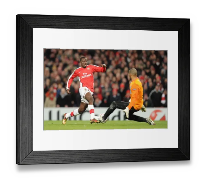Framed Print : Emmanuel Eboue's Stunning Goal: Arsenal Crushes Porto 5-0 in Champions League
