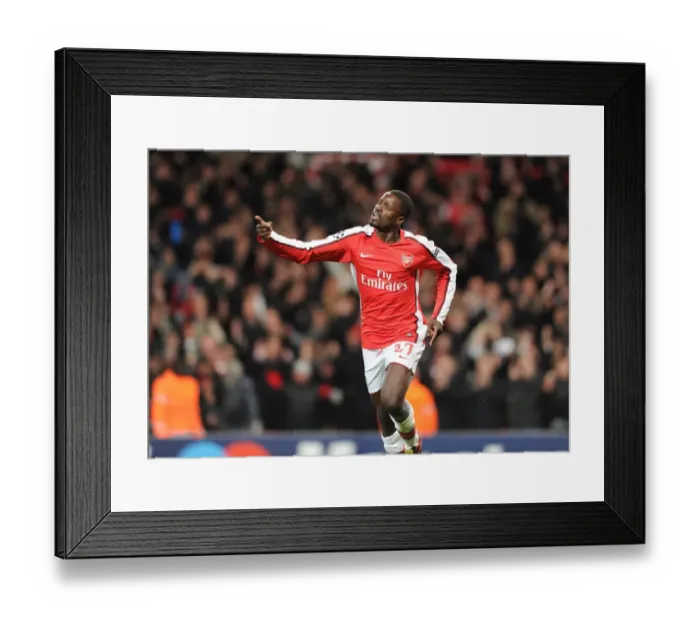 Framed Print : Emmanuel Eboue celebrates scoring the 4th Arsenal goal. Arsenal 5: 0 FC Porto