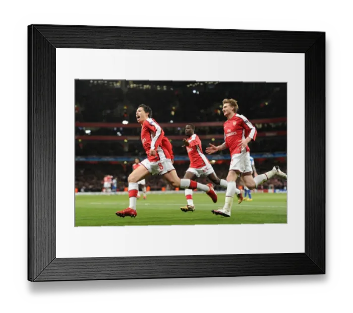 Framed Print : Triumphant Triple: Nasri, Bendtner, and Eboue Celebrate Arsenal's 5-0 Victory over FC Porto