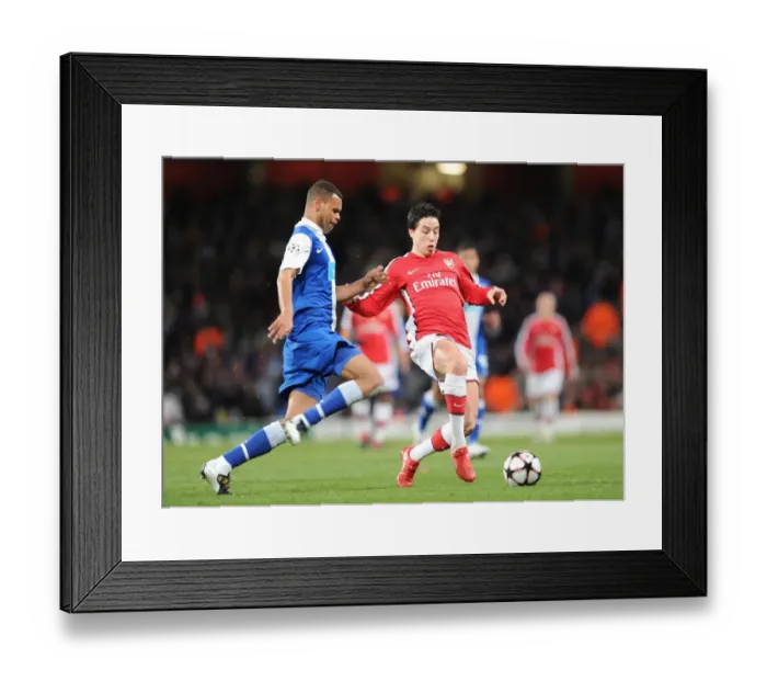 Framed Print : Samir Nasri (Arsenal) Rolando (Porto). Arsenal 5: 0 FC Porto, UEFA Champions League First Knockout Round, Second Leg, Emirates Stadium, Arsenal Football Club, London, 9  /  3  /  2010. Credit : Stuart MacFarlane  / 