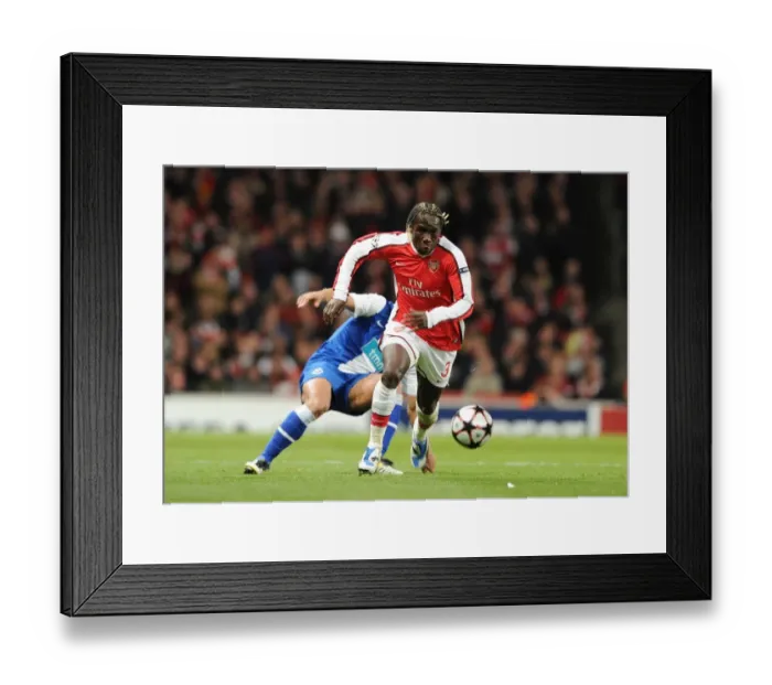 Framed Print : Bacary Sagna (Arsenal) Hulk (Porto). Arsenal 5: 0 FC Porto, UEFA Champions League First Knockout Round, Second Leg, Emirates Stadium, Arsenal Football Club, London, 9  /  3  /  2010. Credit : Stuart MacFarlane  / 