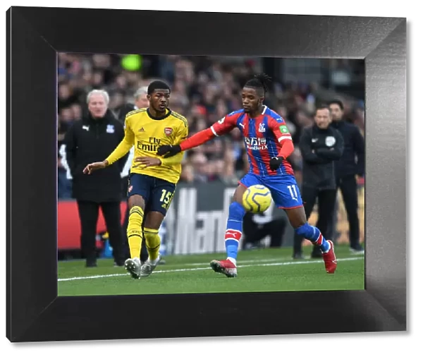 Arsenal's Maitland-Niles Faces Pressure from Zaha in Crystal Palace Clash (Premier League 2019-20)