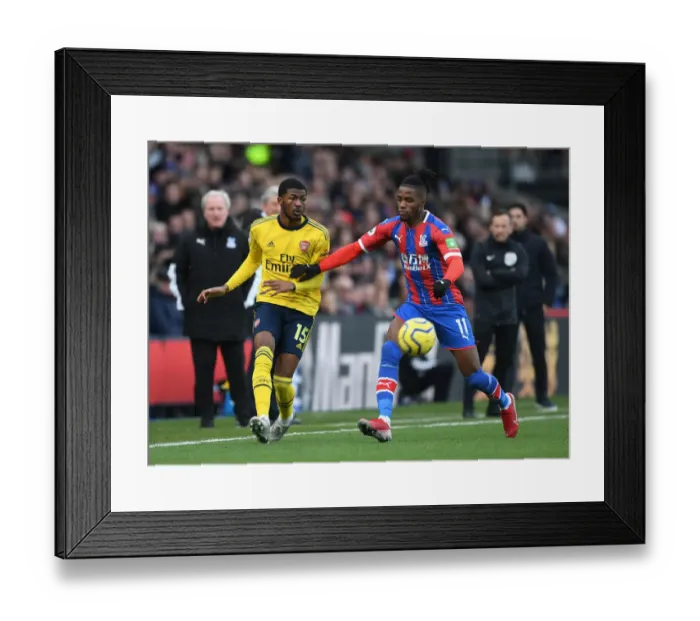 Framed Print : Arsenal's Maitland-Niles Faces Pressure from Zaha in Crystal Palace Clash (Premier League 2019-20)