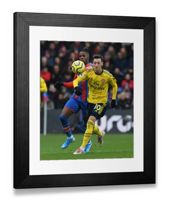 Framed Print : Mesut Ozil Under Pressure: A Tense Clash at Selhurst Park - Crystal Palace vs. Arsenal FC, Premier League 2019-20