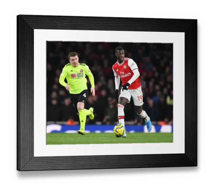 Framed Print : Arsenal's Nicolas Pepe Shines in Premier League Clash Against Sheffield United Framed Print : Arsenal's Nicolas Pepe Shines in Premier League Clash Against Sheffield United