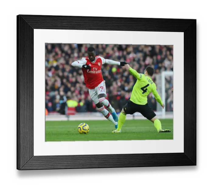 Framed Print : Pepe's Slick Moves: Outsmarting Fleck in Arsenal's Thrilling Premier League Victory Framed Print : Pepe's Slick Moves: Outsmarting Fleck in Arsenal's Thrilling Premier League Victory