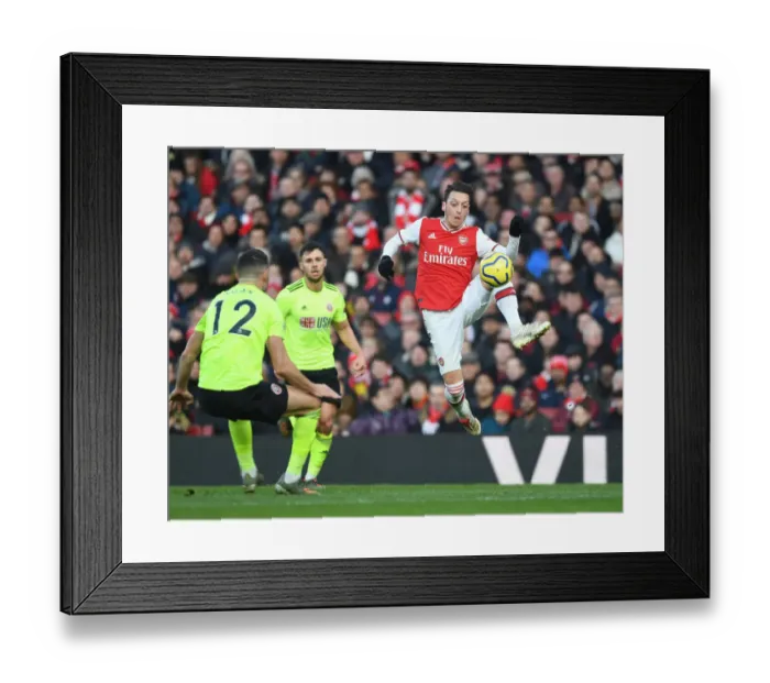 Framed Print : Intense Clash: Ozil vs. Egan in the Premier League - Arsenal vs. Sheffield United