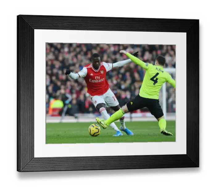 Framed Print : Pepe Outwits Fleck: Arsenal's Star Winger Dazzles in Premier League Clash Framed Print : Pepe Outwits Fleck: Arsenal's Star Winger Dazzles in Premier League Clash