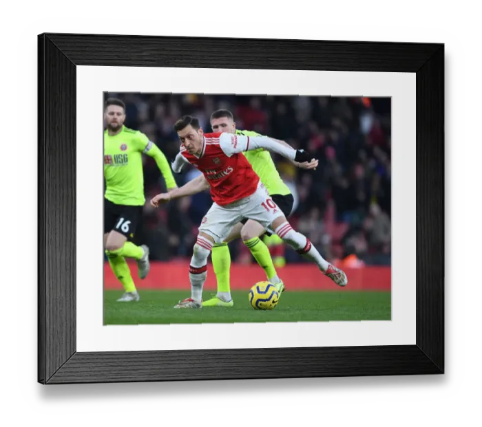 Framed Print : Intense Clash: Mesut Ozil vs. John Lundstram in Premier League Showdown at Arsenal's Emirates Stadium