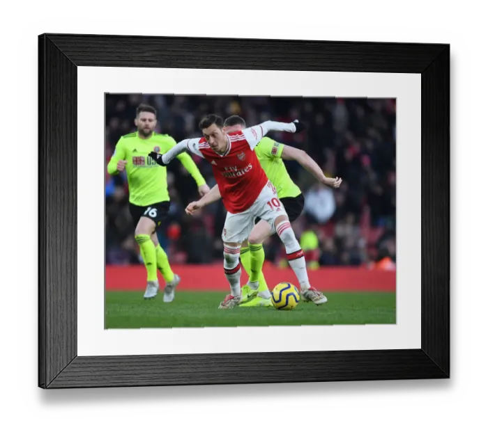 Framed Print : Ozil vs. Lundstram: A Battle of Midfield Masters in Arsenal vs. Sheffield United Premier League Clash Framed Print : Ozil vs. Lundstram: A Battle of Midfield Masters in Arsenal vs. Sheffield United Premier League Clash