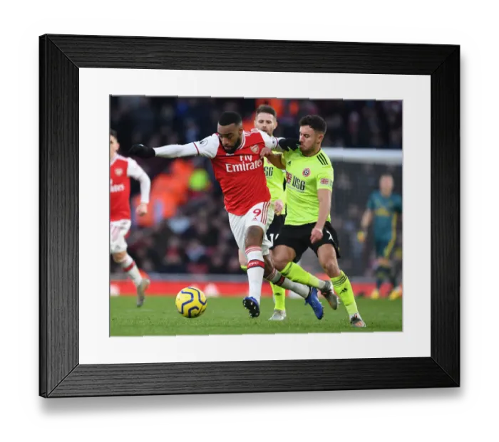 Framed Print : Intense Battle: Lacazette vs Baldock in Arsenal vs Sheffield United Premier League Clash Framed Print : Intense Battle: Lacazette vs Baldock in Arsenal vs Sheffield United Premier League Clash
