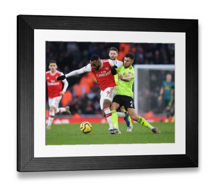Framed Print : Intense Face-Off: Lacazette vs. Baldock in Arsenal's Battle Against Sheffield United Framed Print : Intense Face-Off: Lacazette vs. Baldock in Arsenal's Battle Against Sheffield United