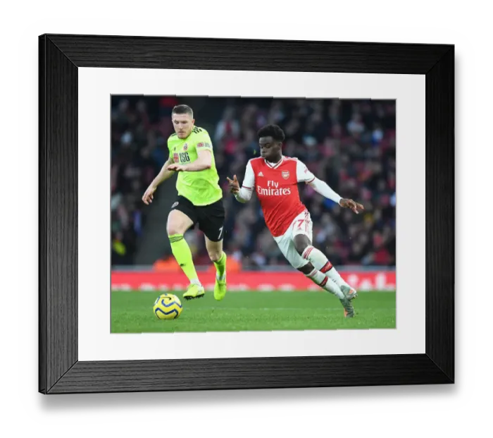 Framed Print : Intense Rivalry: Bukayo Saka vs. John Lundstram - Arsenal's Battle Against Sheffield United Framed Print : Intense Rivalry: Bukayo Saka vs. John Lundstram - Arsenal's Battle Against Sheffield United
